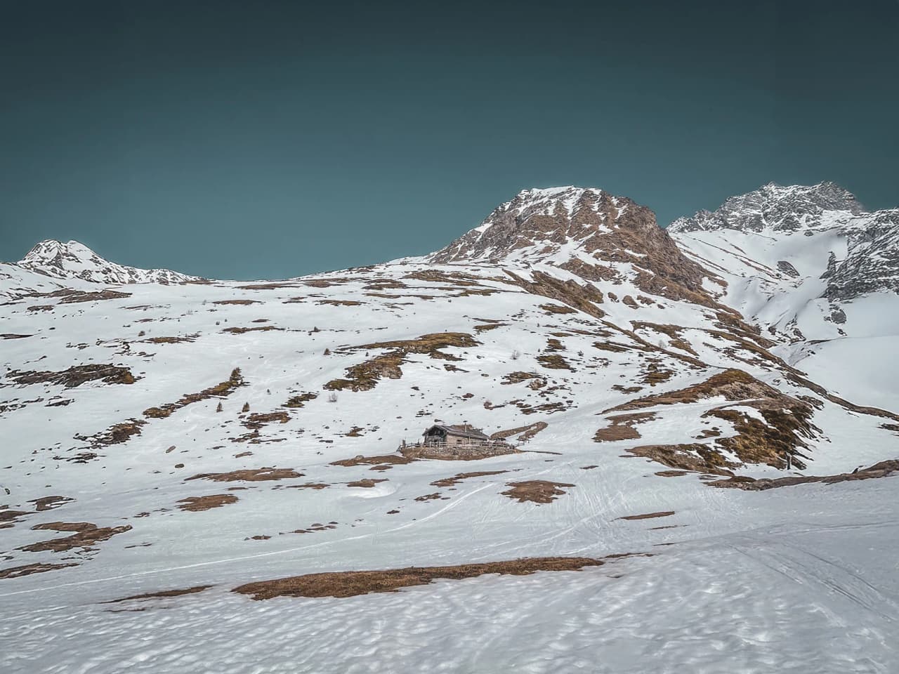 Majestic Alpine scenery on the Great St Bernard Pass, immaculate snow and steep peaks.