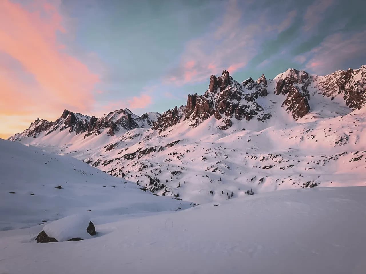 A majestic Alpine landscape, snow-capped mountains and pastel skies, an invitation to adventure.