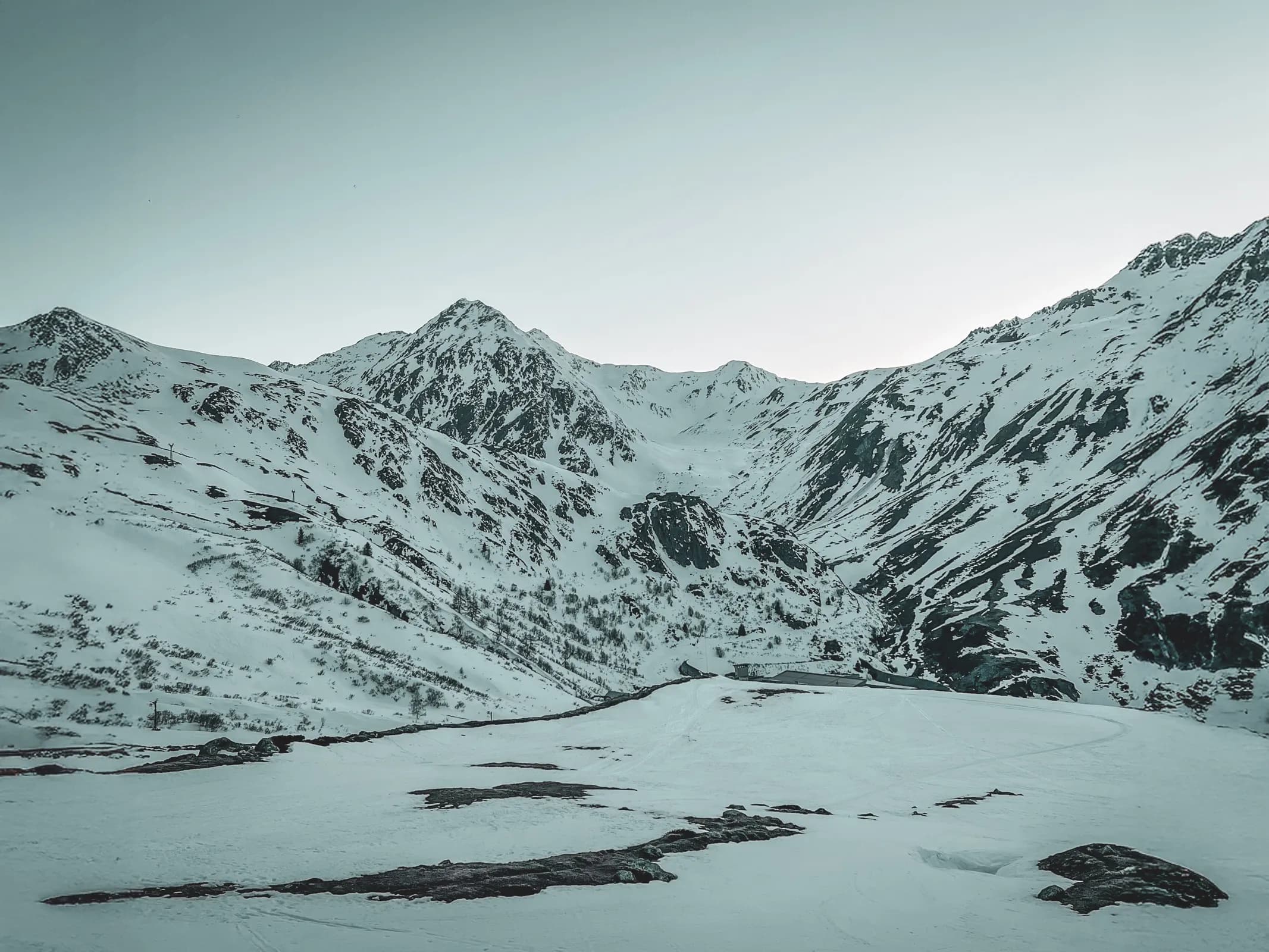 A majestic, snow-covered Alpine landscape that's an invitation to adventure and hiking.