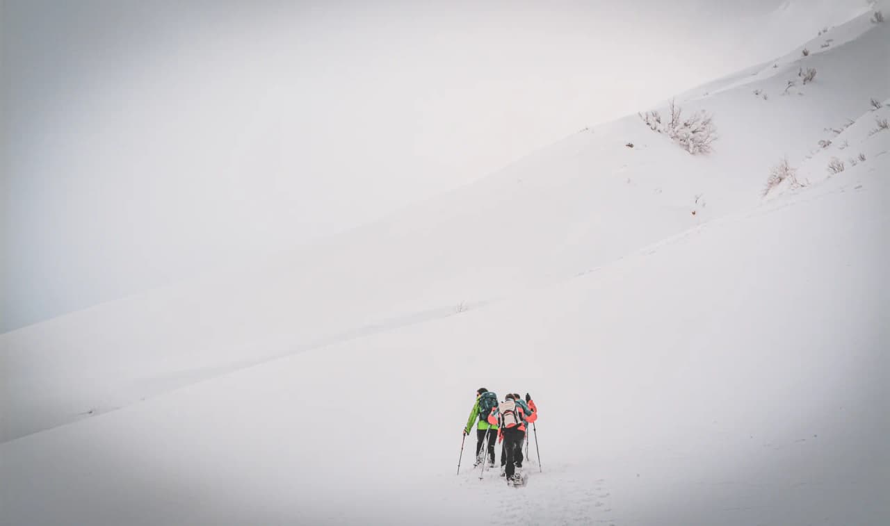 Hiker walking in the snow-covered Clarée valley