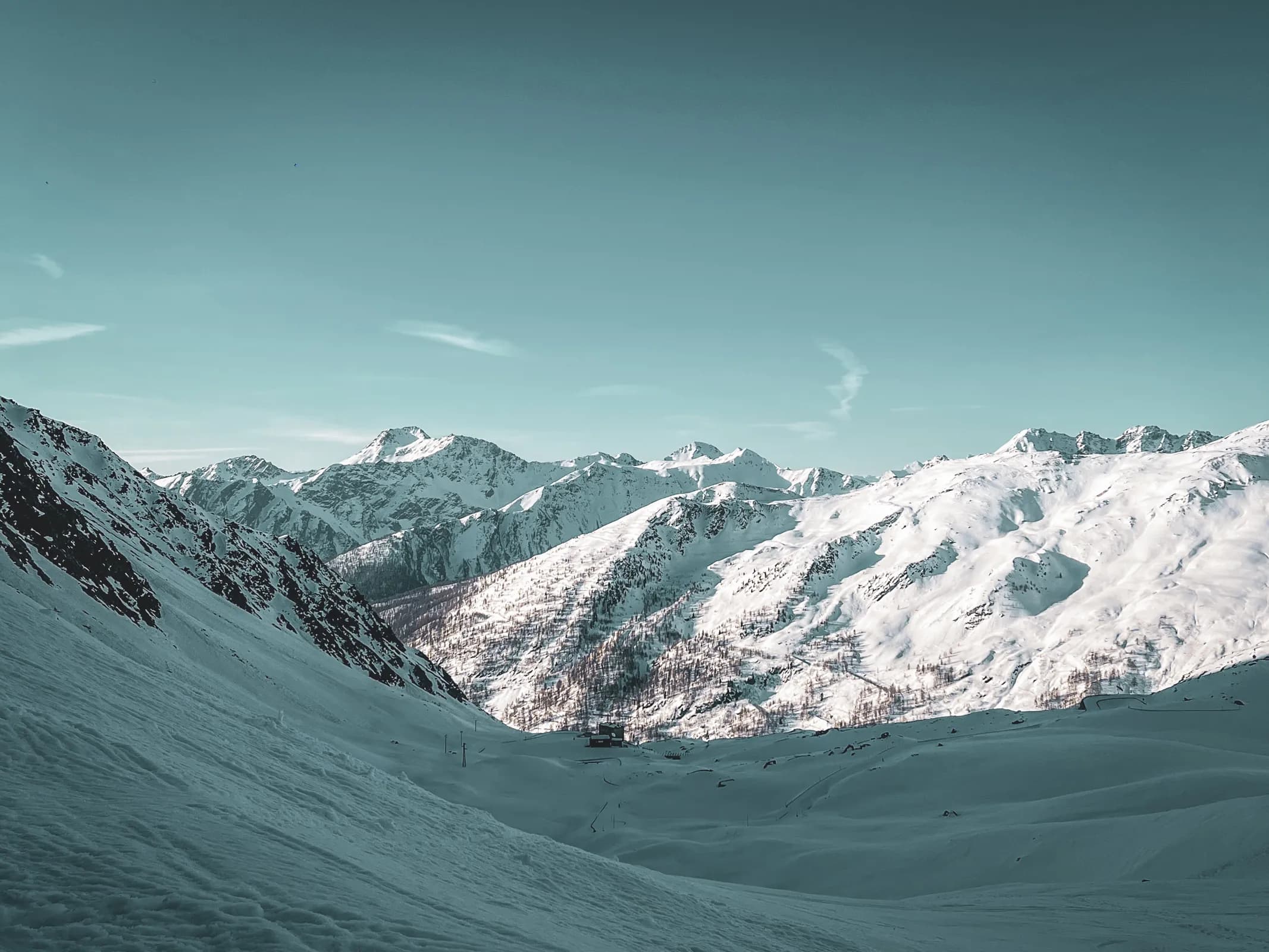 Dazzling Alpine panoramas from the Great Saint Bernard Pass, immaculate snow and majestic peaks.