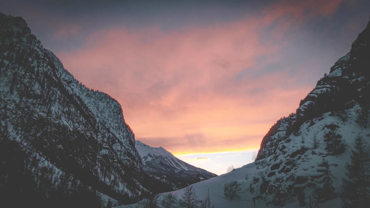 A magical sunset over the snow-capped mountains of the Clarée valley.
