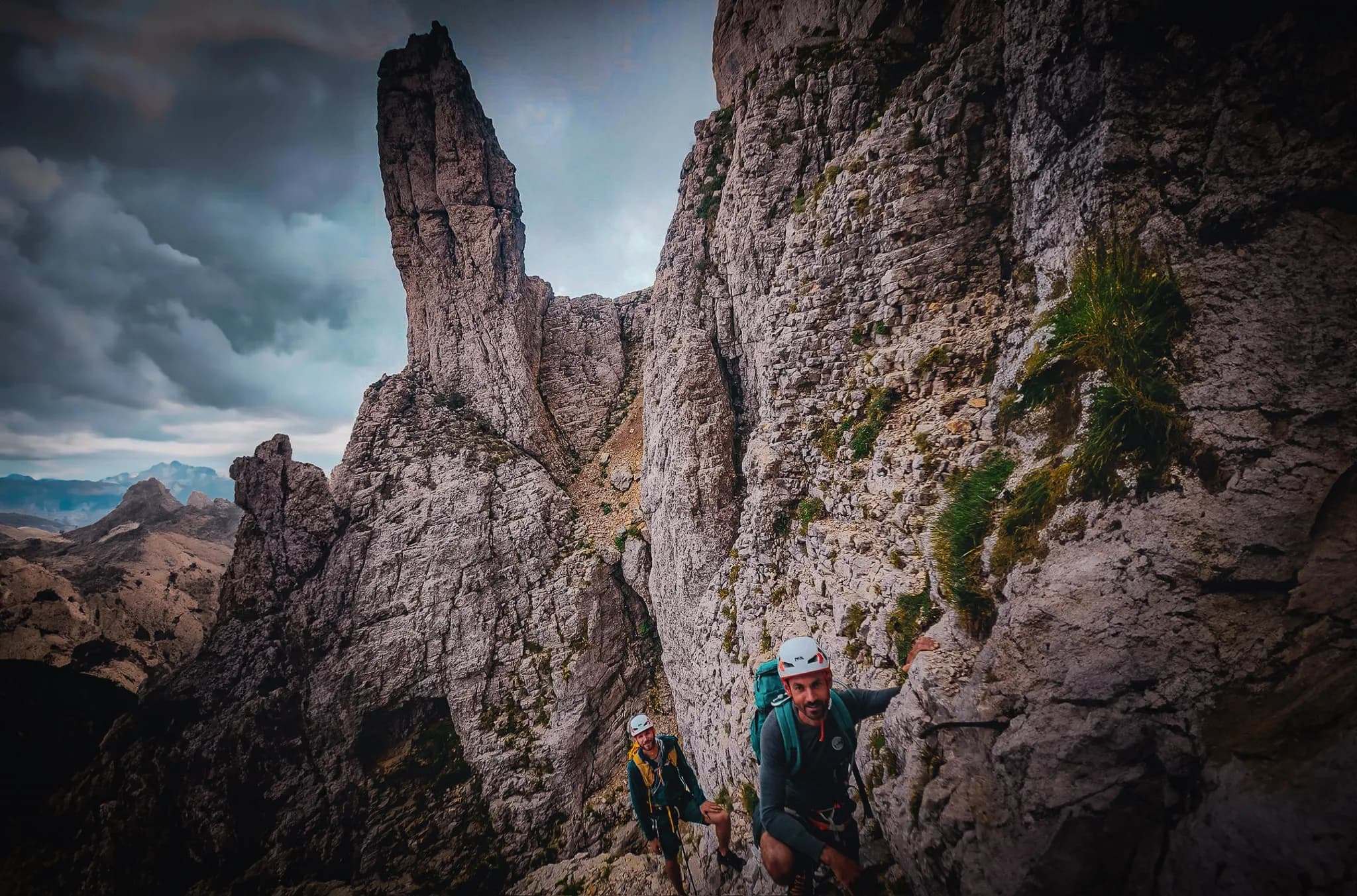 Climbers tackling the rocks of Mont Aiguille, a majestic panorama of the Vercors.