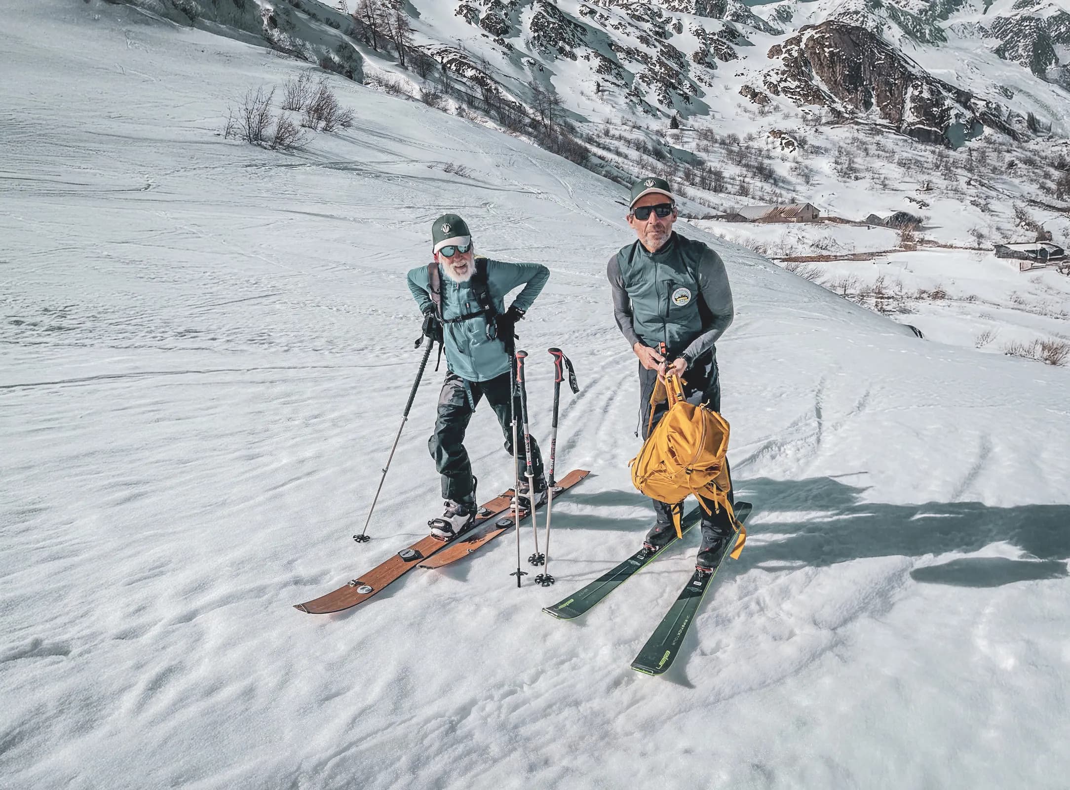Two skiers on a snow-covered path over the Great Saint Bernard Pass, ready for an alpine adventure.