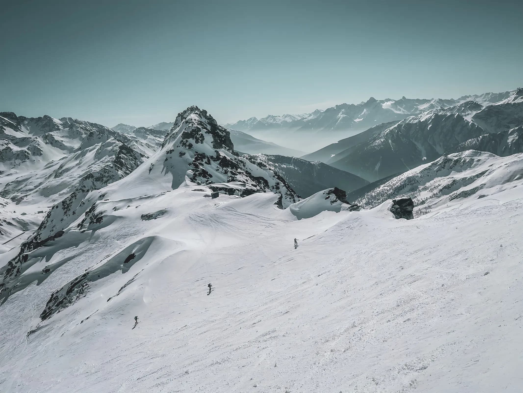 Snow-covered mountain scenery on the Great Saint Bernard Pass, ideal for ski touring.