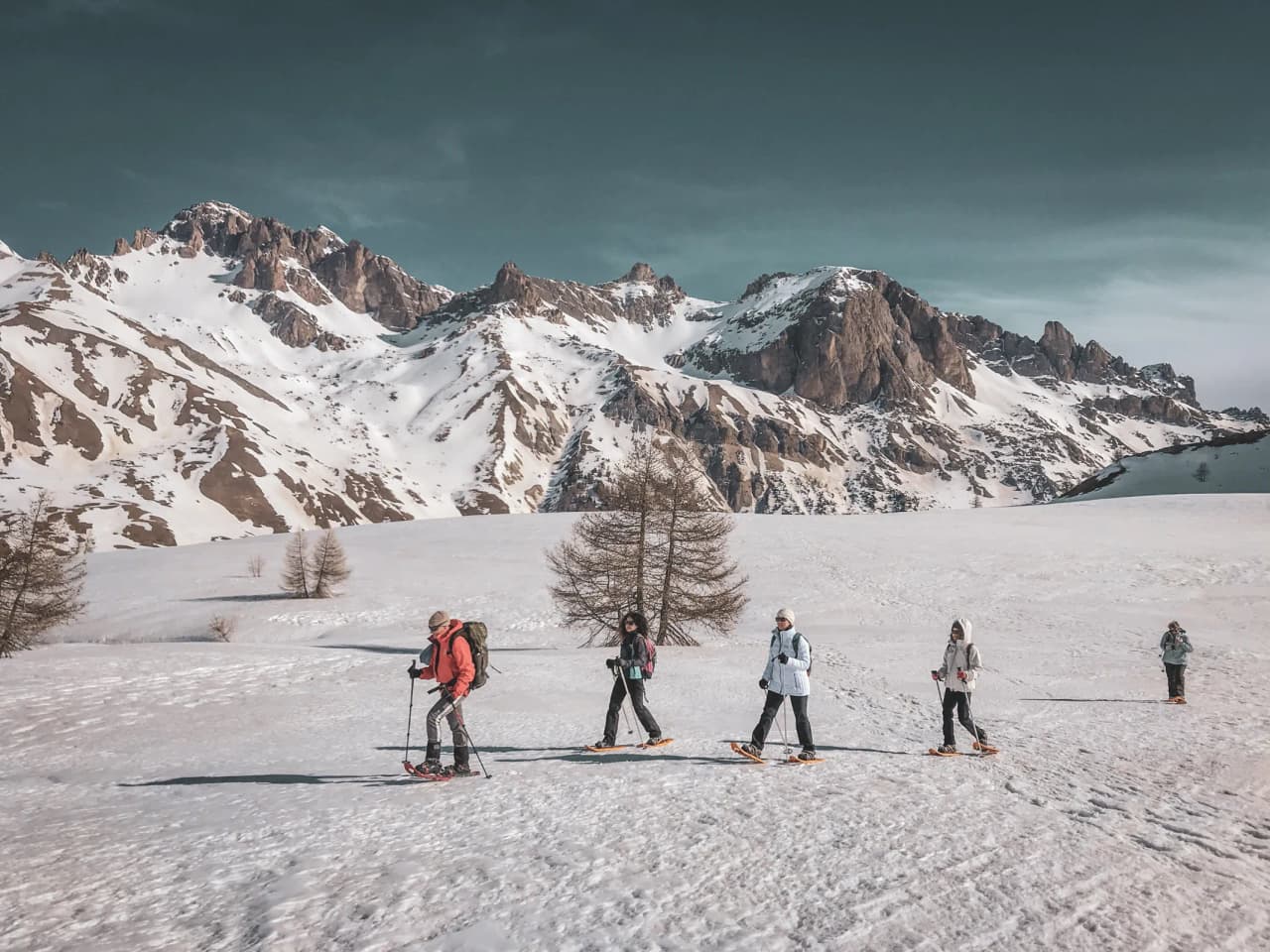 Snowshoe trekking in the heart of the Écrins glaciers, breathtaking snow-covered landscapes.